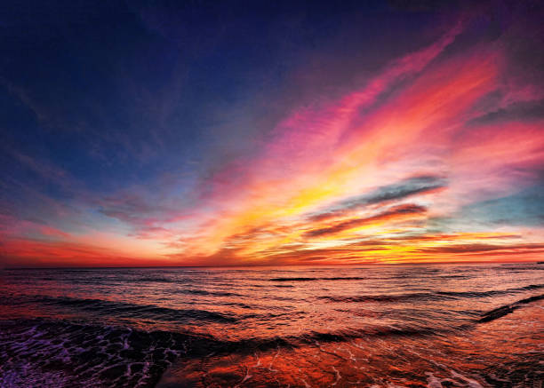 istock Awesome golden hour sunset over the beach with wonderful pastel colored sky 1130653684
