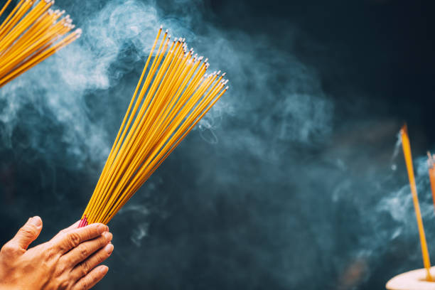 sticks burning in temple, hong kong, china, asia - burning incense imagens e fotografias de stock