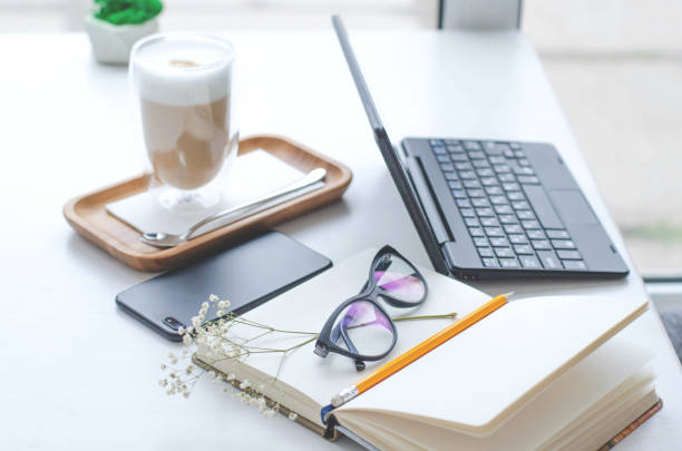 istock A table in a bright cafe with latte and freelancer work details. 1130655651