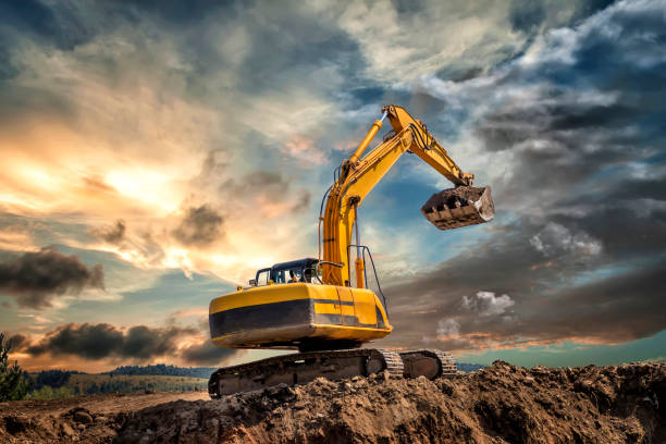 Crawler excavator Crawler excavator during earthmoving works on construction site at sunset bulldozer photos stock pictures, royalty-free photos & images