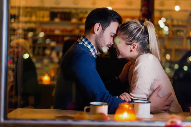 istock Happy couple kissing at bar and having date 1130657302