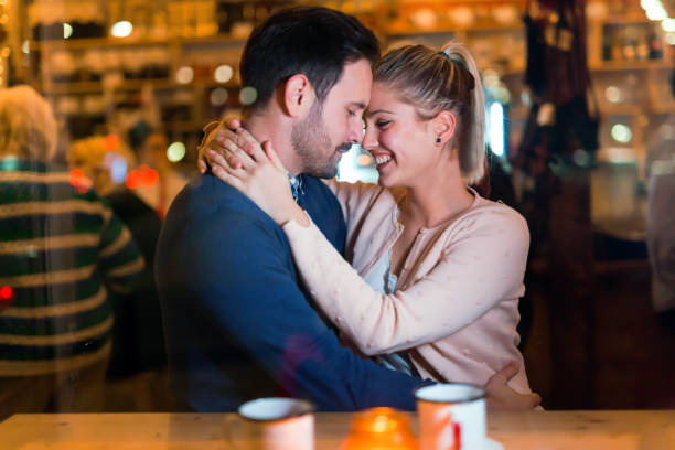 istock Happy couple hugging at bar and having date 1130657306