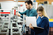istock Young attractive students of mechatronics working on project 1130657510