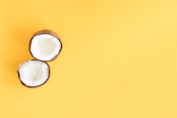 istock Creative layout of coconut on yellow background. Flat lay. 1130659327