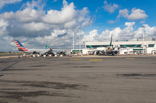 London, UK - April 19, 2022: Stands full of British Airways planes at the main Terminal 5 building at London's Heathrow Airport on a sunny spring morning.