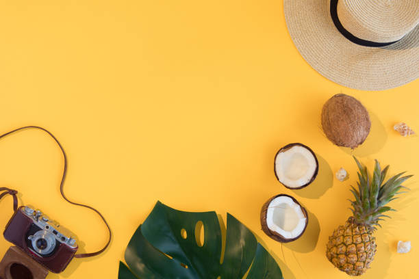 istock Summer vacation flat lay concept on yellow background. Tropical accessories top view. Space for text. 1130659963