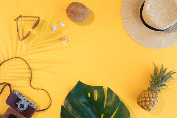 istock Summer vacation flat lay concept on yellow background. Tropical accessories top view. Space for text. 1130659980