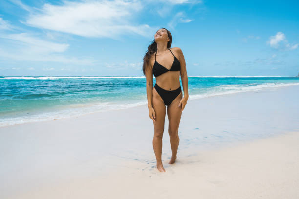 istock Young woman having fun at seaside 1130660738