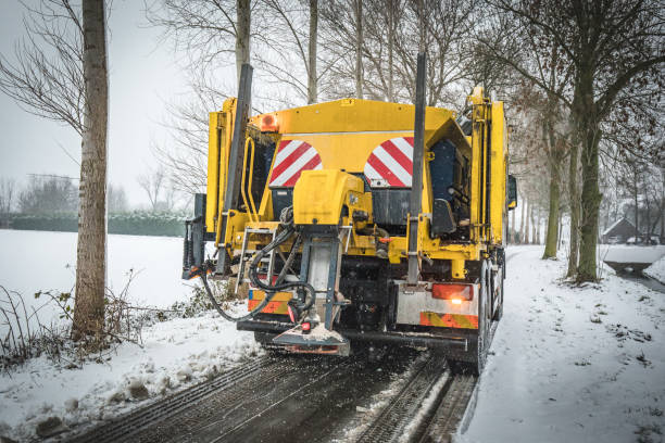 istock Winter service truck spreading salt on road 1130661029