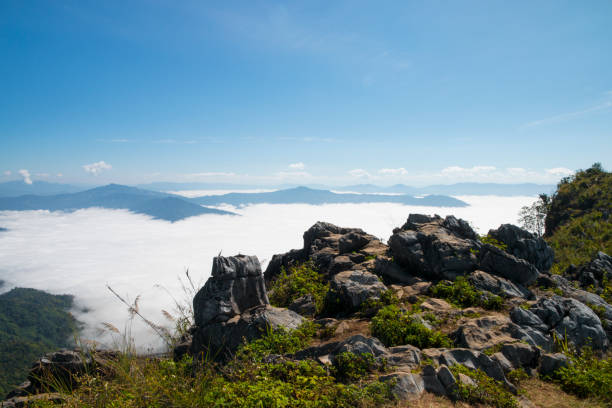 istock cliff at the valley and mountains with mist in the daylight 1130662771