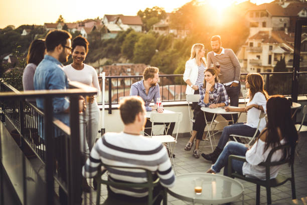 istock Large group of happy business people communicating on a balcony after work. 1130664417