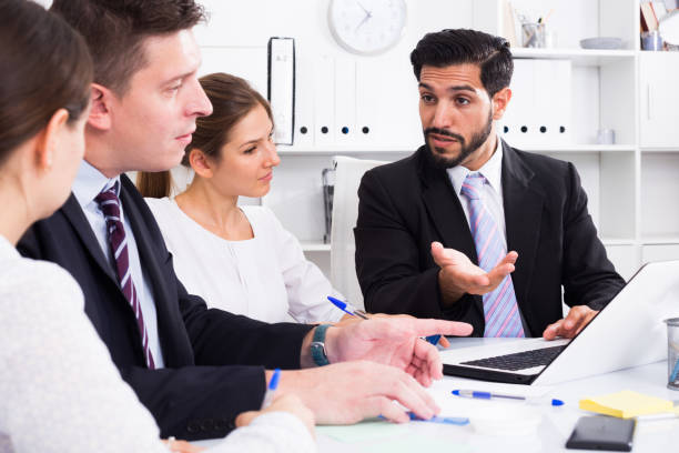 istock Businessman with colleagues in office 1130664823