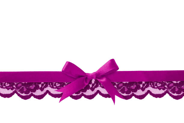 Violet lace and satin bow in line arrangement on white background