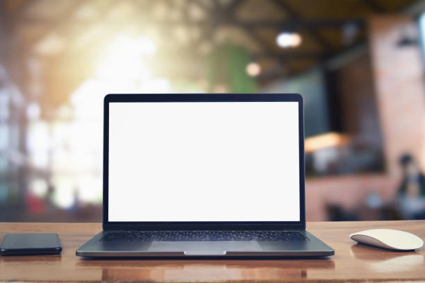istock laptop computer blank white screen and mobile on table in cafe background 1130666913