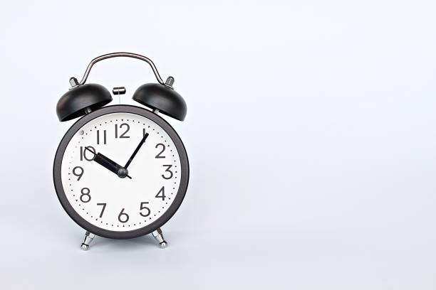 istock Black retro alarm clock on white background with copy space, ready for adding or mock up 1130668528