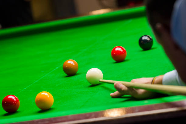 istock playing snooker - man aiming the cue ball 1130668781