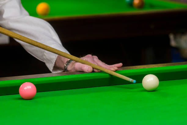 istock playing snooker - man aiming the cue ball 1130670135