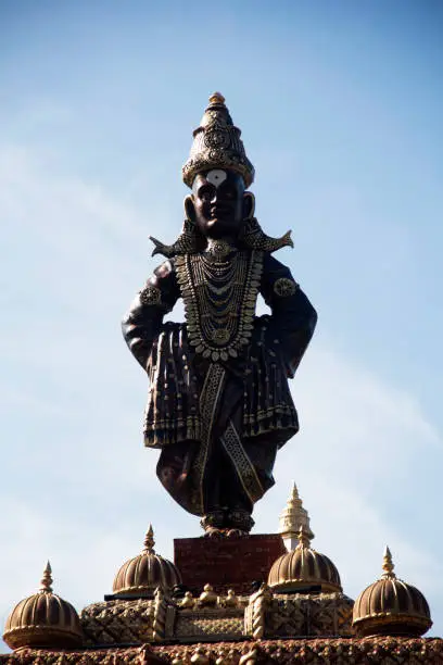 Photo of Standing statue of Lord Vitthal, close-up, during Ganpati Festival, Pune