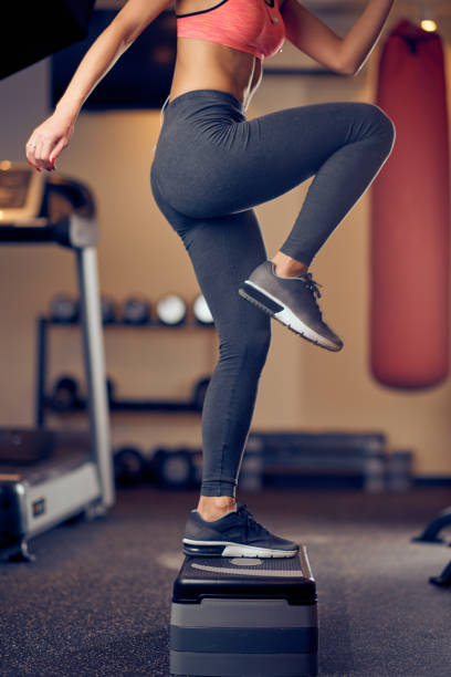 istock Caucasian woman doing exercises on steps . 1130670339