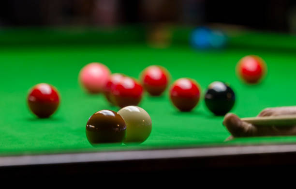istock playing snooker - man aiming the cue ball 1130670343
