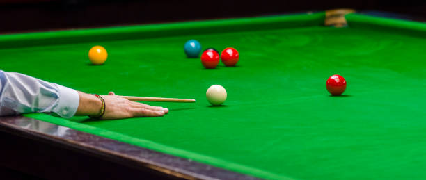 istock playing snooker - man aiming the cue ball 1130670504