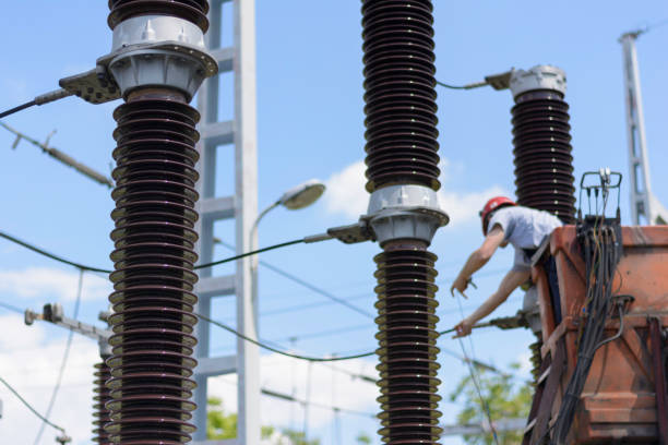 istock Electrician working on circuit braker in distribution electricity substation 1130671817