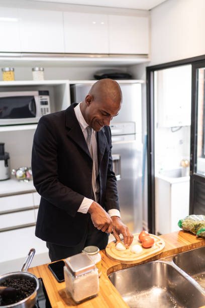istock Businessman cooking at home 1130672096