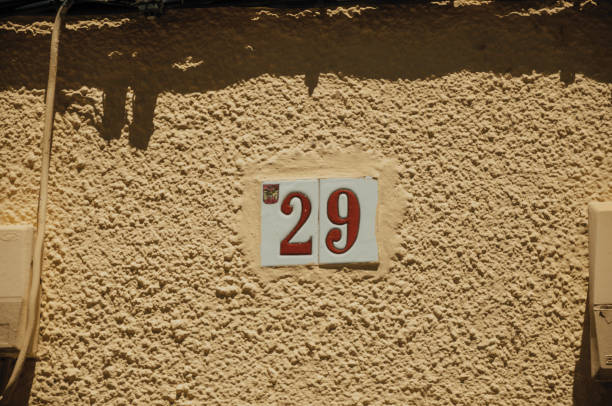 istock Street sign with the number twenty nine in a wall at Merida 1130673473