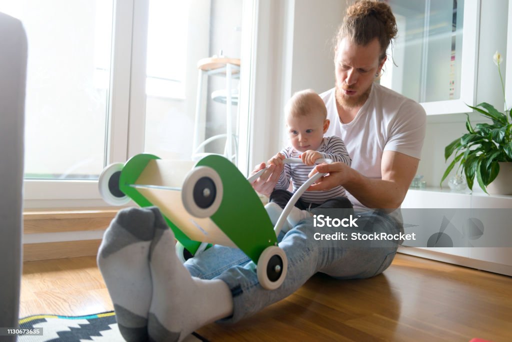 Father and son playing Young family with baby boy 12-17 Months Stock Photo