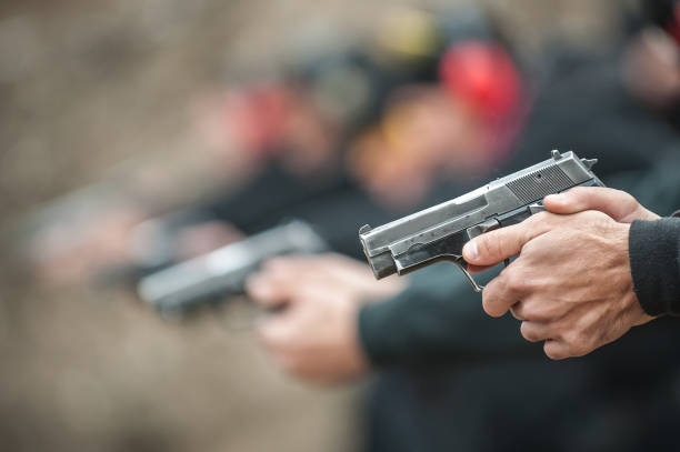 istock Close-up view of shooter practice handgun shooting in row group 1130674876