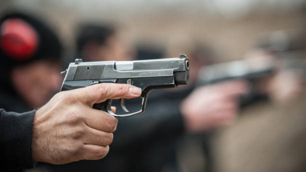istock Close-up view of shooter practice handgun shooting in row group 1130674954