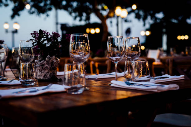 istock Luxury table settings for fine dining with and glassware, beautiful blurred  background. For events, weddings. 1130675015