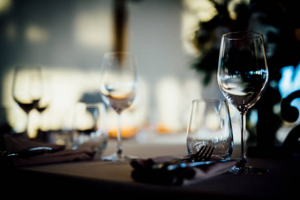 istock Luxury table settings for fine dining with and glassware, beautiful blurred  background. For events, weddings. 1130675183