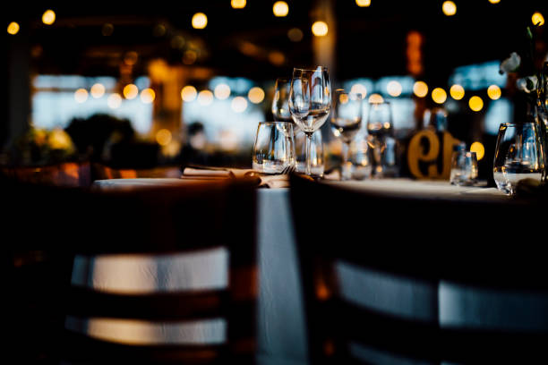 istock Luxury table settings for fine dining with and glassware, beautiful blurred  background. For events, weddings. 1130675186
