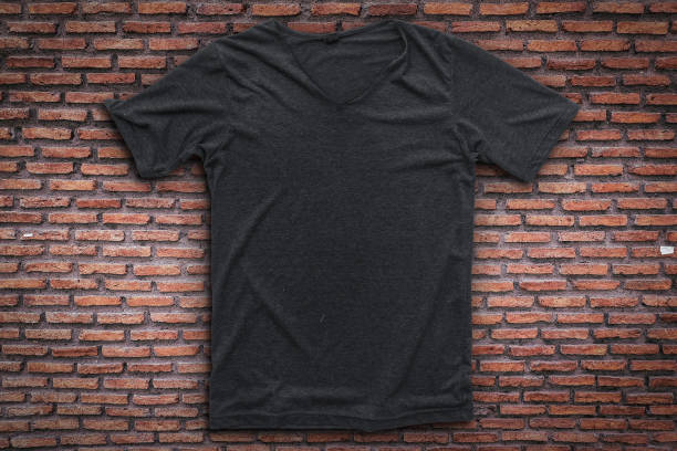 istock Grey t-shirt on brick wall background. 1130675276