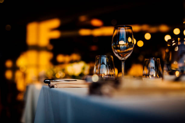 istock Luxury table settings for fine dining with and glassware, beautiful blurred  background. For events, weddings. 1130675509