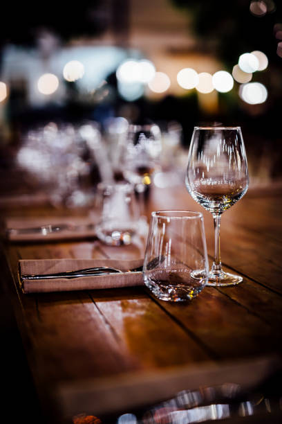 istock Luxury table settings for fine dining with and glassware, beautiful blurred  background. For events, weddings. 1130676236