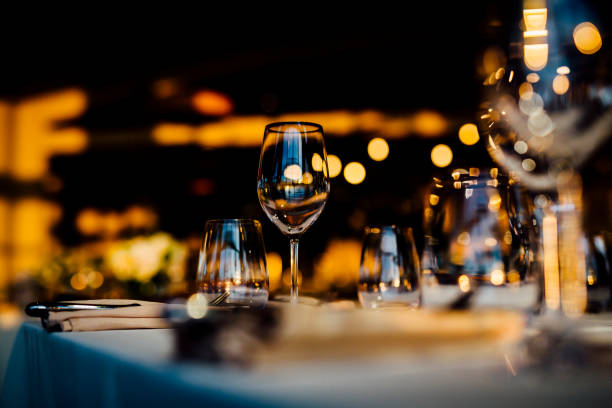 istock Luxury table settings for fine dining with and glassware, beautiful blurred  background. For events, weddings. 1130676298