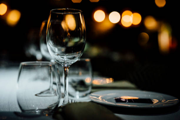 istock Luxury table settings for fine dining with and glassware, beautiful blurred  background. For events, weddings. 1130676300