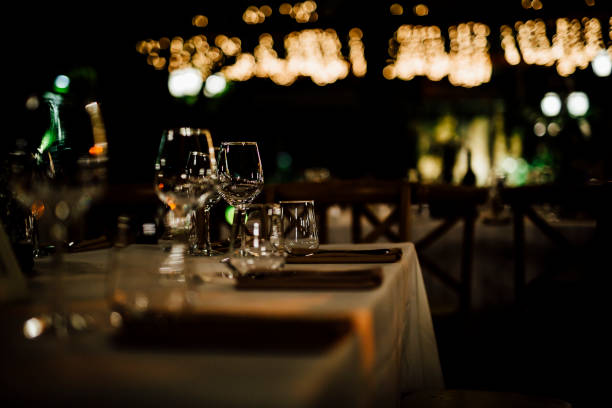 istock Luxury table settings for fine dining with and glassware, beautiful blurred  background. For events, weddings. 1130676314