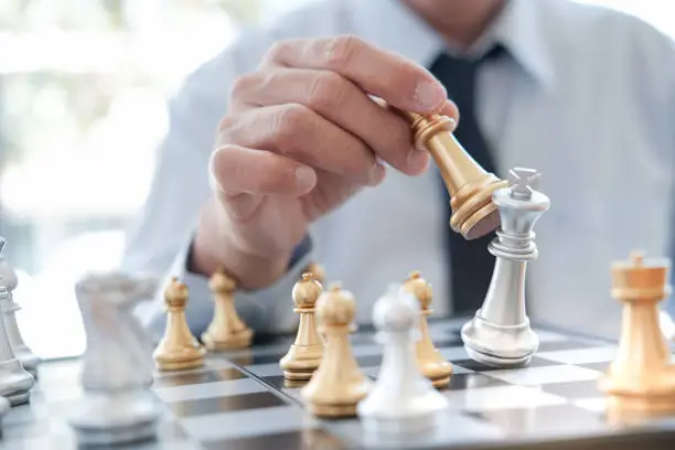 Photo of Businessman play with chess game. success management concept of business strategy and tactic challenge.