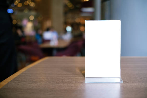 istock Menu frame standing on wood table in Bar restaurant cafe. space for text marketing promotion. 1130676435