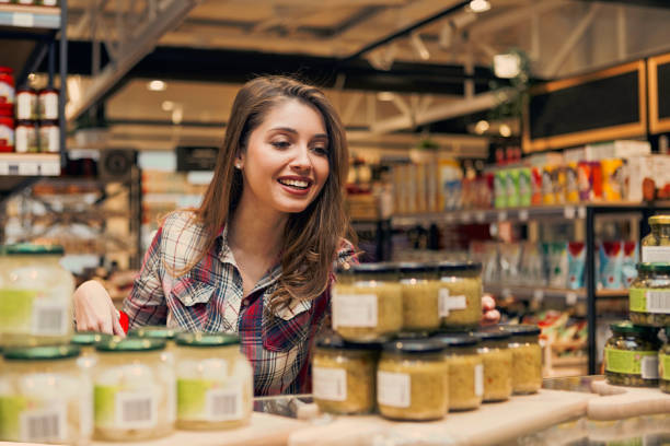 istock Young woman browsing through the store looking best prices 1130676553