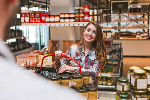 istock Young woman having conversation in a store 1130676606