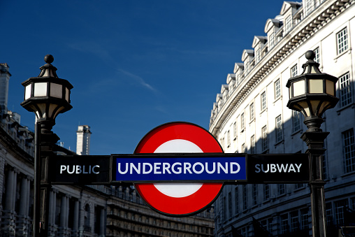 A London Underground Subway sign at Piccadilly Circus on a sunny day. London, England : January 2019