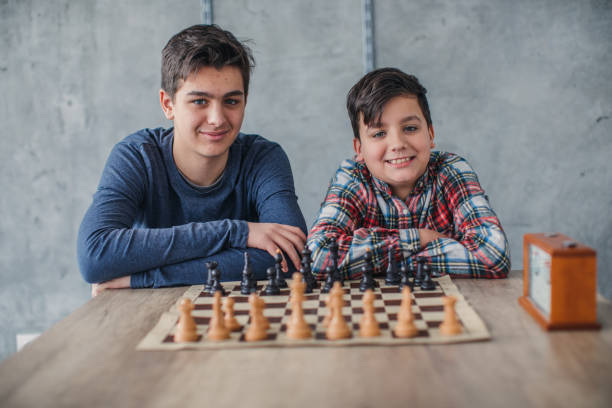 istock Two young boys in chess school 1130680371