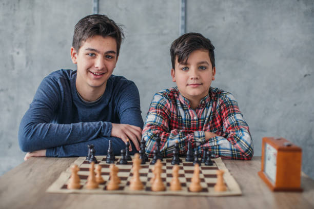 istock Smart boys in chess school 1130680380