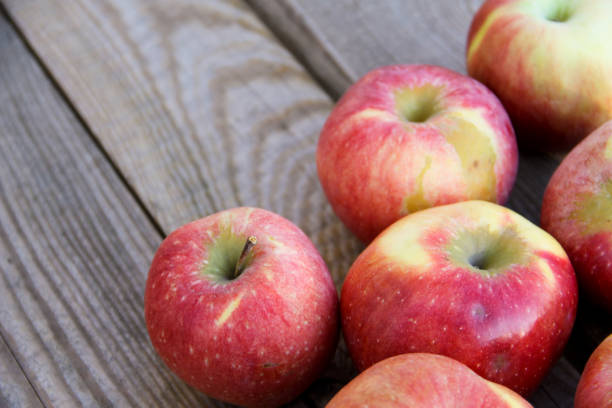 istock Fresh red apples on wooden table 1130683121