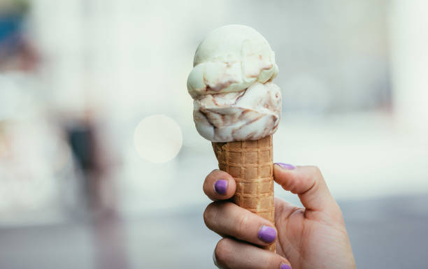 istock Woman holds ice in her hand, beautiful summer day 1130683443
