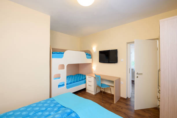 istock Bedroom in blue color with TV 1130684753